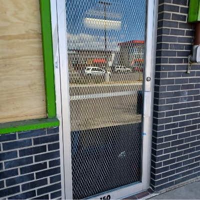 broken-storefront-door-smoke-shop-after